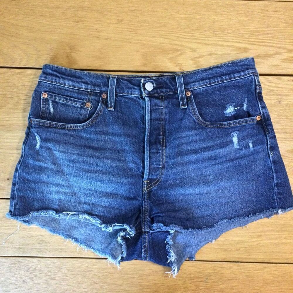 Levi’s 501 raw hem dark blue button fly Jean shorts 31